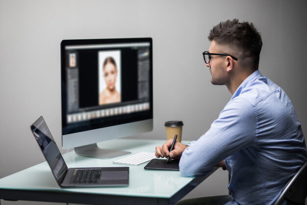 cropped-side-view-man-photo-editor-using-graphics-tablet-bright-office_264277-758.jpg